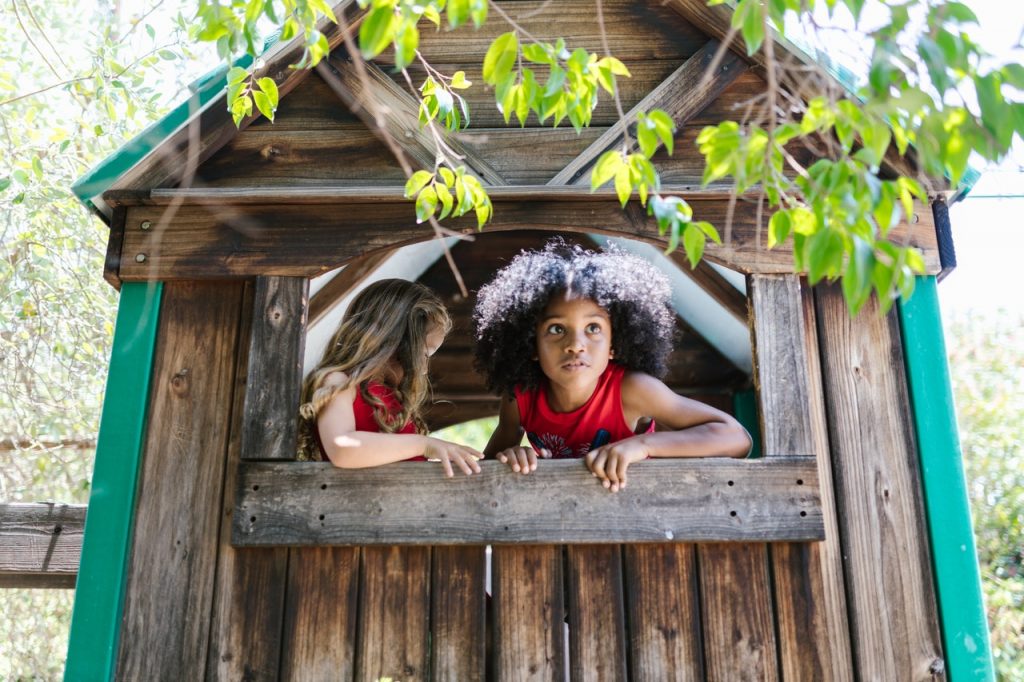 children in a tree house role play outdoor education
