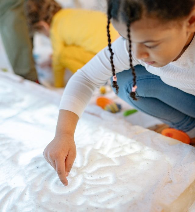 sensory light box preschool child playing snow cave