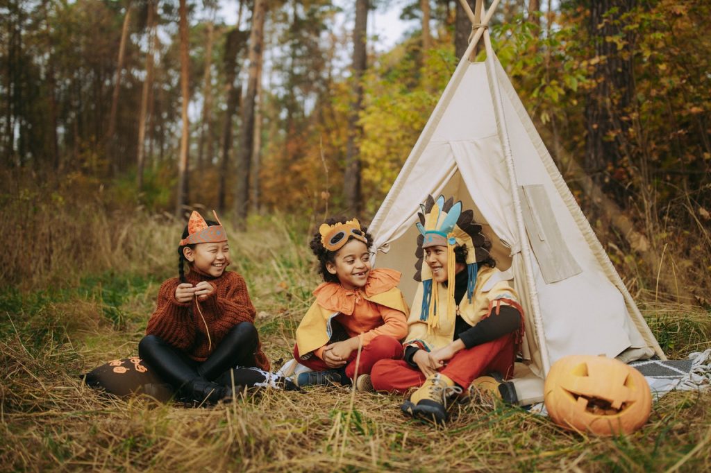 children role play in the woods 