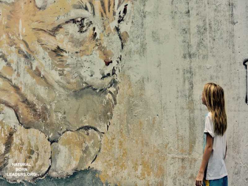 child admiring modern arts mural Penang Malaysia 